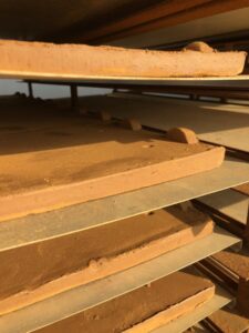 Handmade clay tiles being airdried